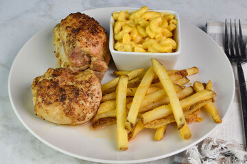 chicken thighs with  macaroni and cheese with french fries