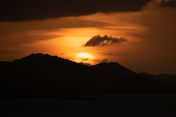 Sunset in St. John Virgin Islands; large yellow sun 