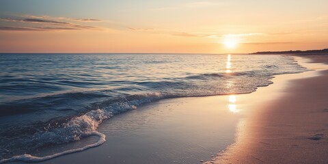 Golden sunset casting warm light over calm waves on the beach, illustrating a serene and beautiful ending of the day.
