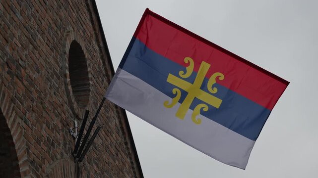 Serbian orthodox church flag with serbian cross 4S symbol, low angle view