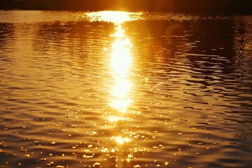 The sun reflects brightly on the calm water, Reflections of the setting sun on a calm body of water, shimmering like liquid gold