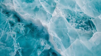 A delicate turquoise marble with soft blue and white veining, displayed on a white surface. 