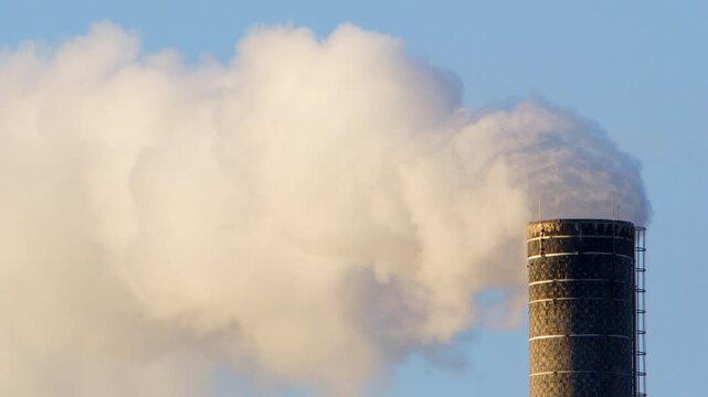 Air pollution by industrial factory chimney emitting toxic gases, zoom in