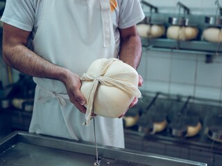 Artisan making traditional Mahon cheese in Menorca