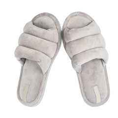 Pair of soft fluffy slippers on white background