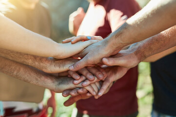 Nature, stack or hands of friends in outdoor park for huddle, playing fun games and social gathering together. Community, holiday and people in group for bonding, support and teamwork on vacation