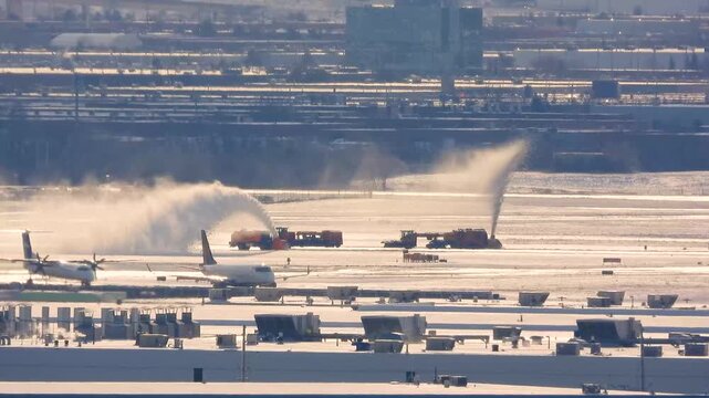 Snow-clearing Equipment Removing Snow At Pearson Airport In Toronto, Canada. wide shot