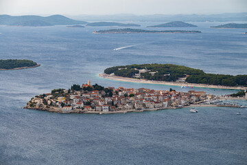 Amazing view on the small, tourist town of Primosten, Croatia built on the hill, surrounded by the...