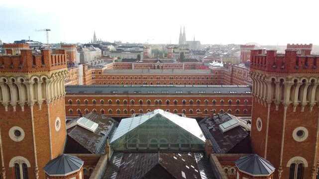 Old historical barracks building in downtown Vienna, aerial drone view during rainfall
