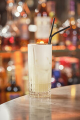 Glass of cocktail on bar counter