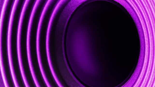Close-Up Of A Speaker In An Audio System Playing Purple Light And Moving
