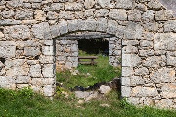 Obraz premium Remains of old, abandoned, stone building at the small village of Majerovo Vrilo, Croatia, on the source of Gacka river