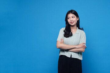 Young beautiful woman wearing shirt over blue isolated background