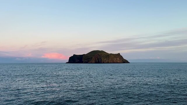 Secluded Ellidaey island at Iceland&rsquo;s Vestmannaeyjar seen from boat