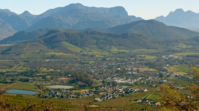 Scenic location of Franschhoek in wine valley surrounded by mountains, top view