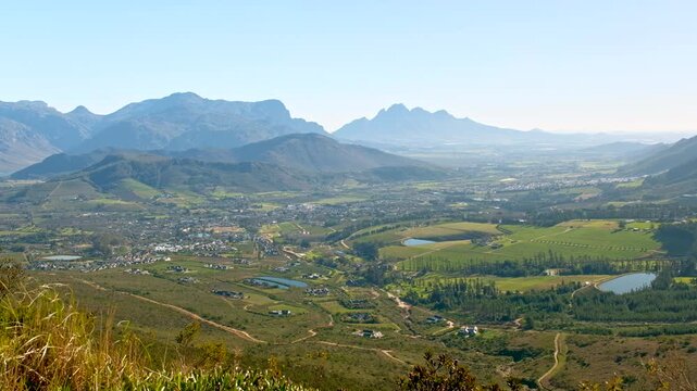 Fertile Franschhoek valley surrounded by mountains, high angle panoramic view