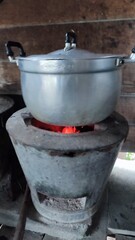 Fototapeta premium Cooking rice in the old days before there were electric rice cookers