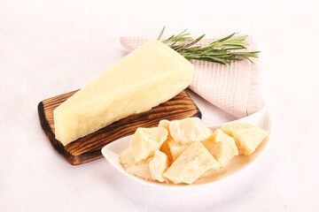 Chopped Italian hard parmesan cheese