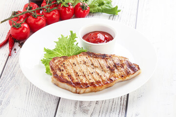 Grilled pork steak with ketchup