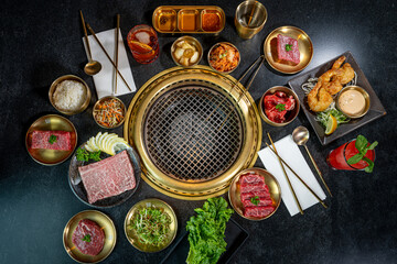 A beautiful spread of Korean Barbecue meats, seafood, veggies and accoutrements.