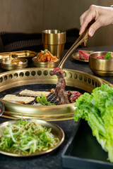 A beautiful spread of Korean Barbecue meats, seafood, veggies and accoutrements.