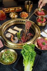 A beautiful spread of Korean Barbecue meats, seafood, veggies and accoutrements.