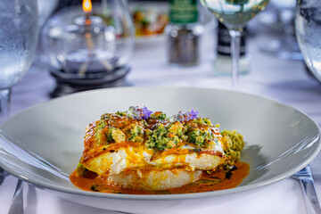 Atlantic Halibut topped with Norwegian Lobster Persillade, Genovese Basil, Tarragon, Fresh Lemon, Buttered Carrot Crème Fraiche, Jasmine Rice