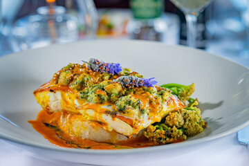 Atlantic Halibut topped with Norwegian Lobster Persillade, Genovese Basil, Tarragon, Fresh Lemon, Buttered Carrot Crème Fraiche, Jasmine Rice