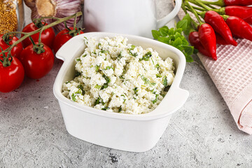 Curd cheese with green herbs