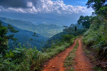 Fototapeta premium A picturesque mountain trail meandering through rugged terrain, with a breathtaking view overlooking a dramatic wall or cliff. The scene captures the essence of adventure and exploration, highlighting