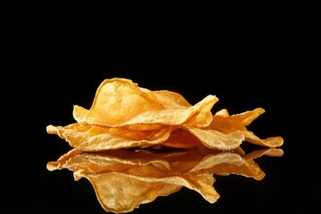Potato Chips on Reflective Surface With Black Background , ai