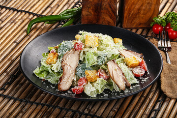 Caesar salad with chicken and romano