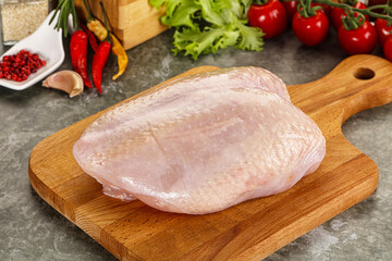 Raw chicken breast with skin