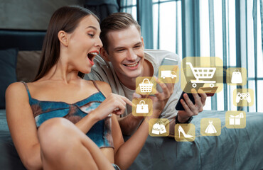 Elegant female and male customer with credit card control mobile phone choosing online platform. Smart consumers opening e-commerce application using cashless technology shopping inventory. Cybercash.