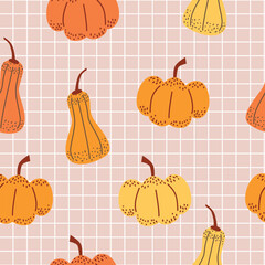 Seamless pattern of pumpkins and squash. Vegetables on pink grid background. Autumn harvest design.