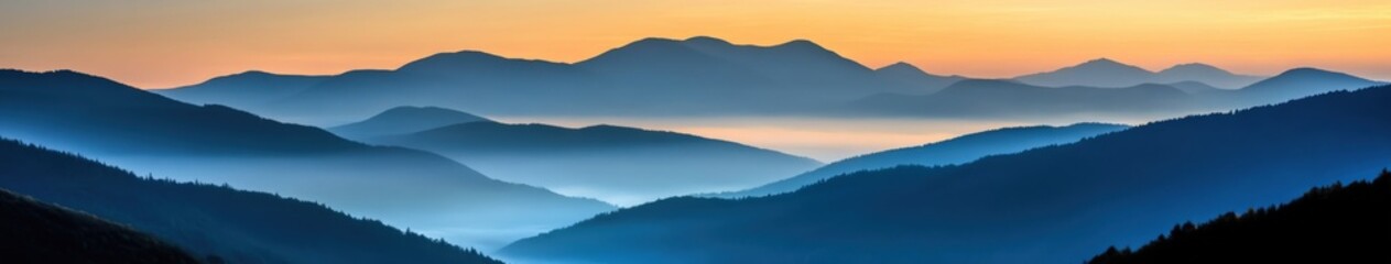 Fototapeta premium Evening fog envelops mountains under twilight sky