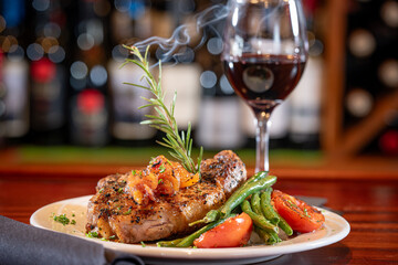 Heritage Pork Porterhouse on a bed of mashed potato with seasonal vegetables