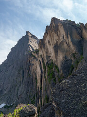 Huge sharp rocks. Pointed cliff. Vertical view.