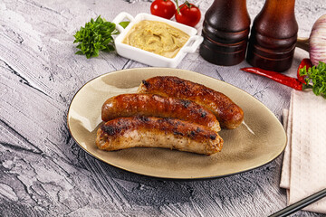 Delicous natural roasted sausages in the plate