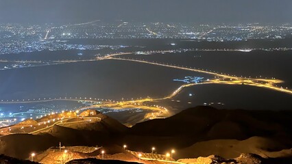 Desert transforms into network of illuminated roads at night, resembling celestial map of highways...