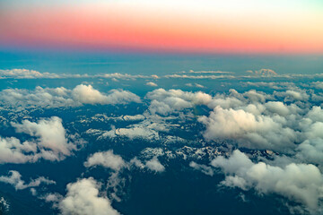 aerial view of snow mountain range in sunrise light