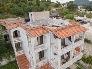 Greece Mediterranean style seaside Resort Hotel 1980s complex apartment residential house ruin, derelict abandoned house building facade s