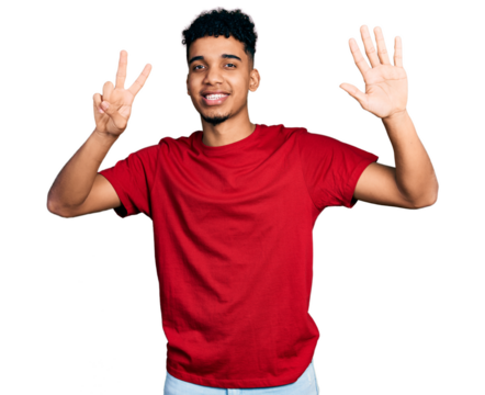 Young african american man wearing casual red t shirt showing and pointing up with fingers number seven while smiling confident and happy.