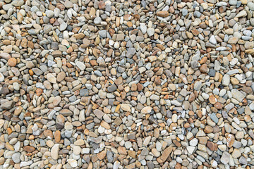 Background of Pebble Stones. A detailed overhead shot of a collection of small pebble stones spread...