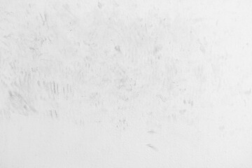 Dirty old white paint concrete wall with cat footprint or paw print red soil stains. Grunge and rough surface.