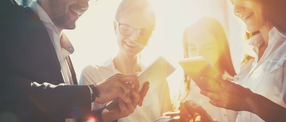 A lively group of professionals exchange ideas and smiles, illuminated by warm sunlight, highlighting their enthusiastic engagement and teamwork.