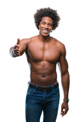 Fototapeta premium Afro american shirtless man showing nude body over isolated background smiling friendly offering handshake as greeting and welcoming. Successful business.