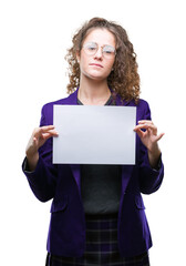Fototapeta premium Young brunette student girl wearing school uniform holding blank paper over isolated background with a confident expression on smart face thinking serious
