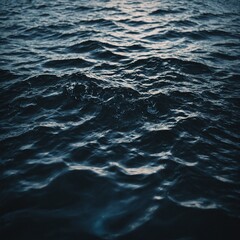 Fototapeta premium The peaceful surface of a river reflecting the vibrant colors of the changing autumn leaves and bright blue sky