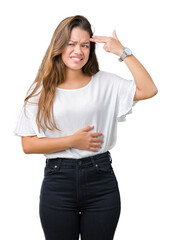 Obraz premium Young beautiful brunette business woman over isolated background Shooting and killing oneself pointing hand and fingers to head, suicide gesture.